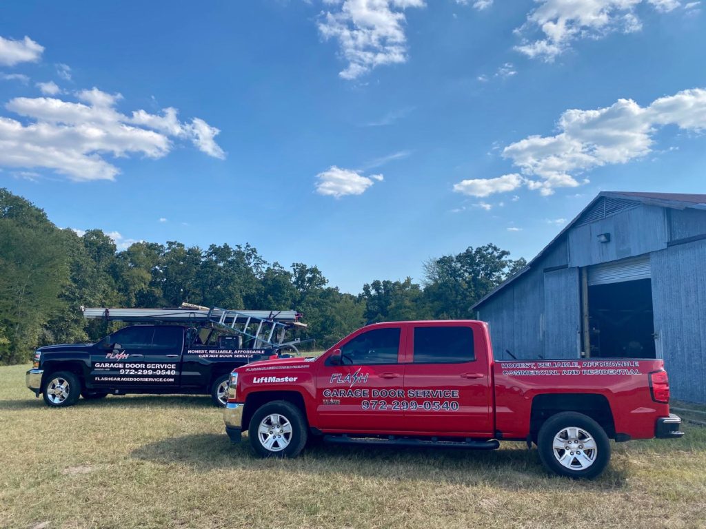 Flash Garage Door Service trucks at a job site in Texas